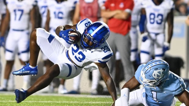 Sep 11, 2021; Chapel Hill, North Carolina, USA; Georgia State Panthers running back Marcus Carroll (23) is tackled by North Carolina Tar Heels defensive back Kyler McMichael (1) n the second quarter at Kenan Memorial Stadium. Mandatory Credit: Bob Donnan-USA TODAY Sports